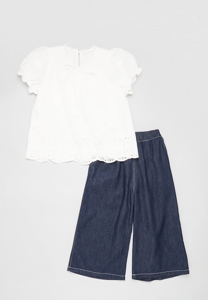 Embroidered lace trim top with flared jeans