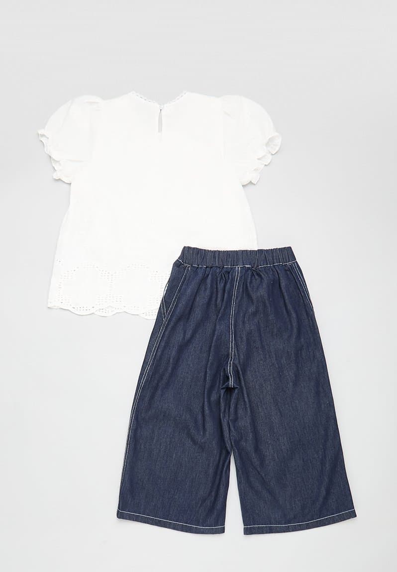 Embroidered lace trim top with flared jeans, view 2