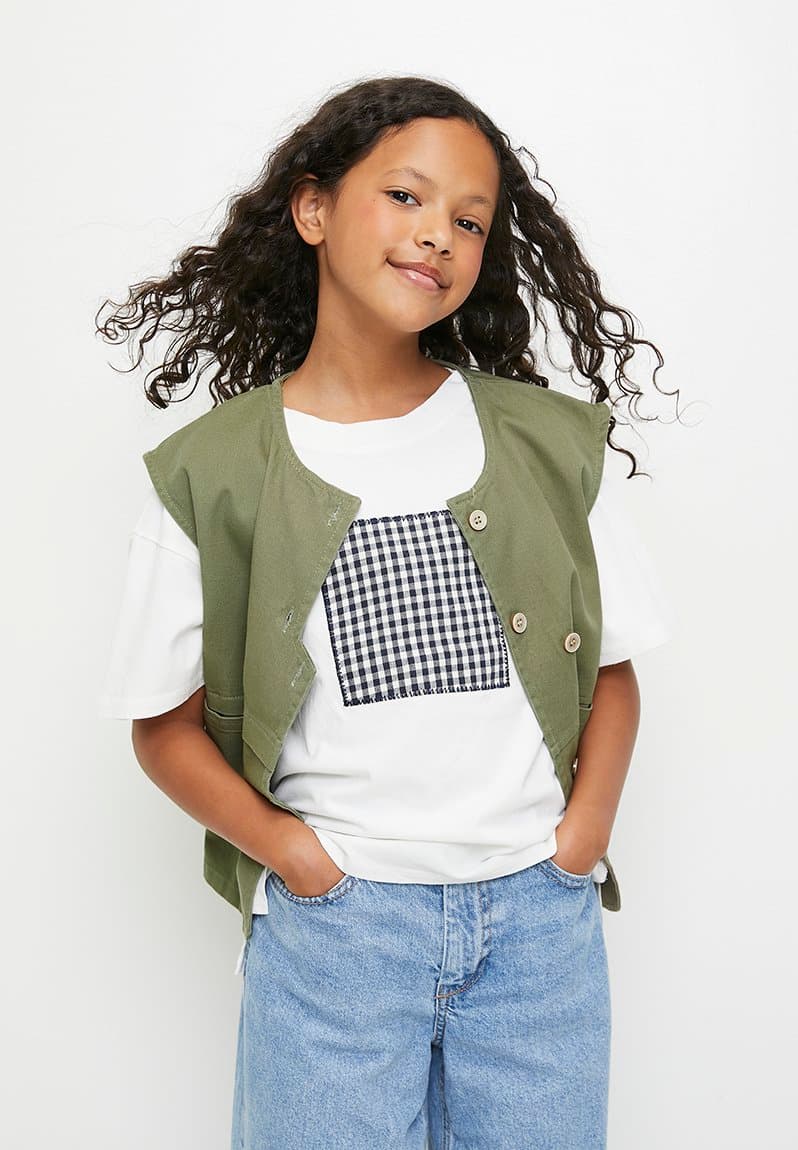 Stylised button closure vest with square patch tee