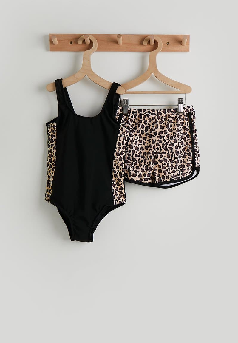 One-piece swimsuit and swim shorts